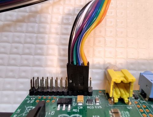 Jumper cables from the card reader attaching to the Pi from the right